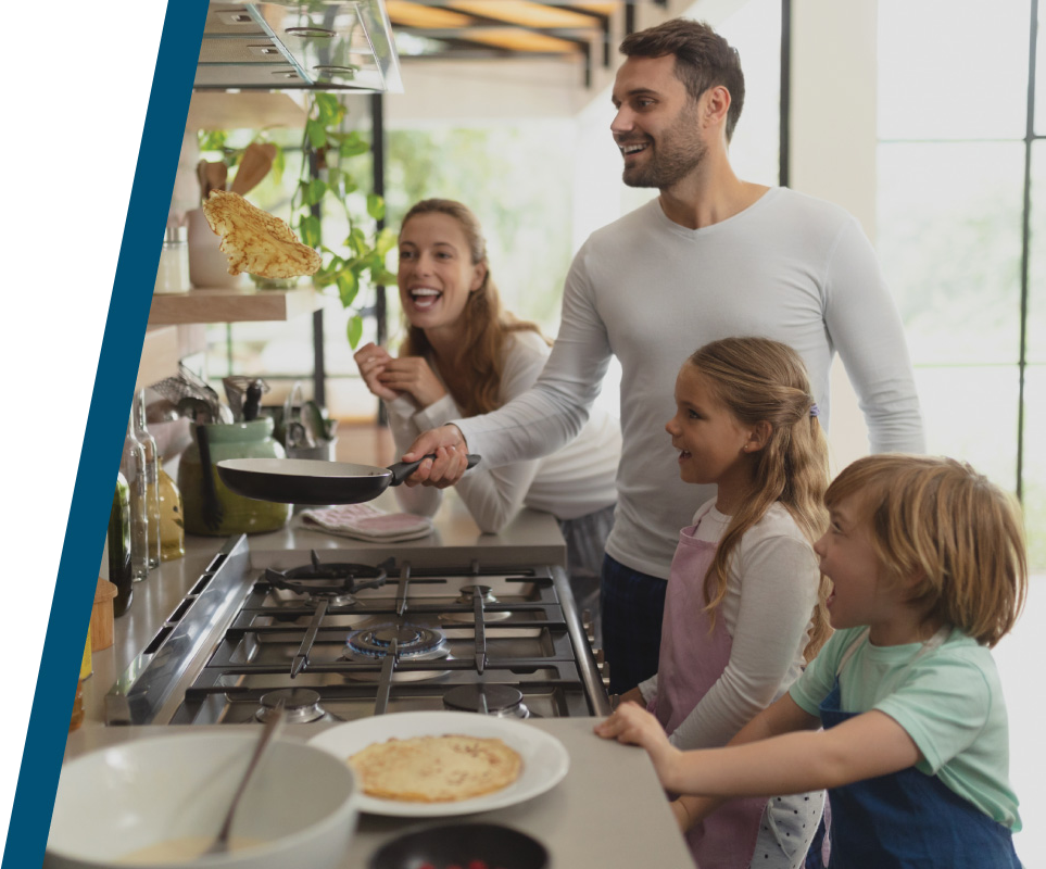 A family cooking at a gas range